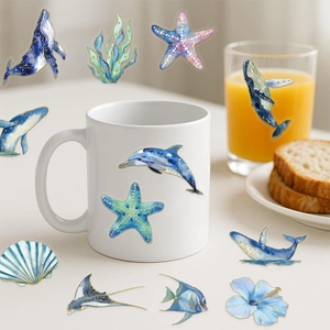 Detailed view of nautical ocean stickers on a ceramic mug with gold constellation accents