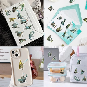 Detail showing medieval fantasy stickers applied to a tablet case and stationery