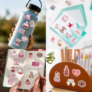 Pink Bookish themed stickers applied on water bottles and journals for decoration