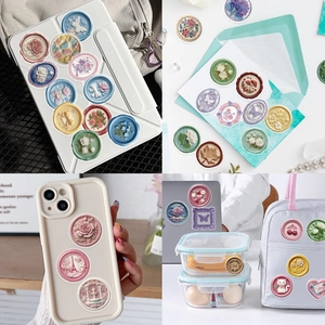 Close-up of 3D embossed floral seal stickers on a phone case and laptop cover