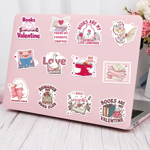 Pink Valentine's Day bookish stickers applied on a laptop with heart and book motifs