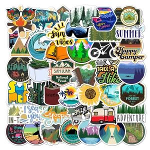 Flat lay of 50 waterproof vinyl stickers for camping and travel with outdoor nature themes