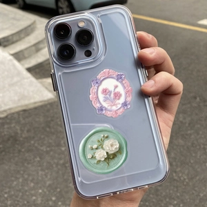 Detail of 3D embossed floral frame and rose seal sticker on a transparent phone case