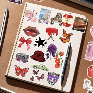 200pcs waterproof Y2K graffiti stickers set for suitcases and journals on wooden desk