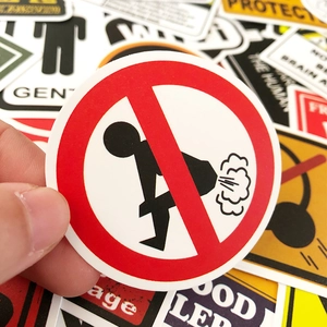 Close-up of a funny no-farting warning sticker with a matte finish for luggage and cars