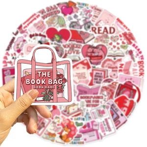 Close-up of pink bookish stickers featuring hand-drawn bag and books design