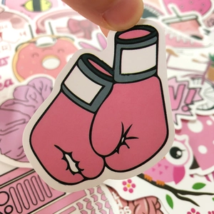 Close-up of pink cartoon boxing glove sticker with clean white border for laptops