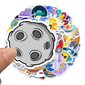 Detail of space stickers set featuring meteorite, UFO and planets on white background