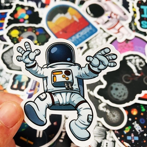 Macro shot of waterproof space astronaut stickers with high-quality PVC print details