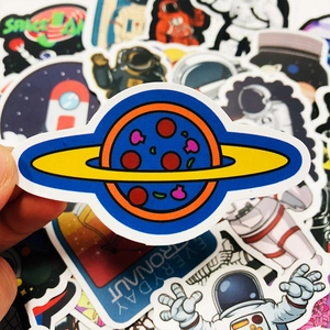 Close-up of waterproof space stickers featuring astronaut and planet pizza designs