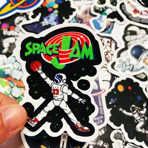 Close-up of a waterproof space astronaut sticker featuring a dunking pose with Space Jam text
