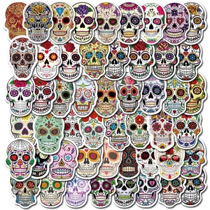 Flat lay of colorful Day of the Dead sugar skull stickers for laptops and luggage
