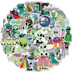 Flat lay of colorful waterproof PVC alien stickers with UFO and space themes for laptops