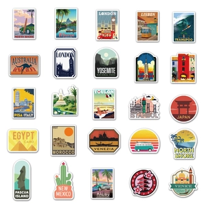 Flat lay of 25 vintage travel stickers featuring world landmarks for luggage and decor