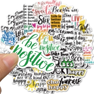 Close-up of waterproof inspirational quote stickers for laptops and water bottles