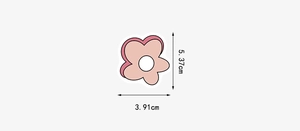 Detail shot of a pink flower sticker with dimensions measuring 5.37cm by 3.91cm