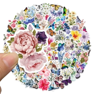 Close-up of waterproof PVC floral and butterfly stickers for scrapbooks and laptops