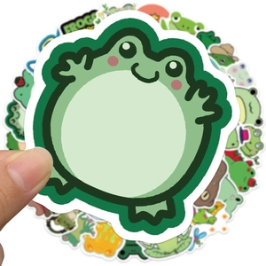 Close-up of waterproof cartoon frog stickers showing white border detail and matte finish
