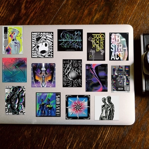 40Pcs Y2K acid style waterproof stickers with 3D metallic cyberpunk designs on laptop
