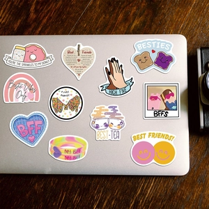 Waterproof Best Friend Forever stickers showing colorful cartoon designs on a laptop
