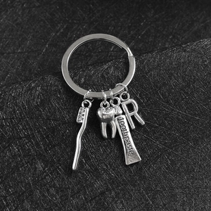Portachiavi in Metallo a Tema Dentale Creativo Spazzolino da Denti Dentifricio Ciondolo Iniziale Argento Lega di Zinco Regalo