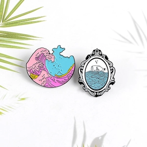 Vintage enamel pins set with pink sea waves and paper boat in a bottle design