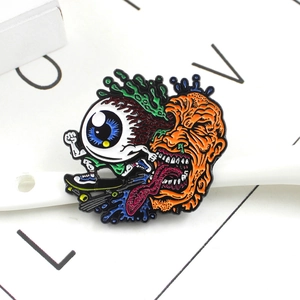 Quirky monster and eyeball on skateboard enamel pin in vibrant colors and zinc alloy