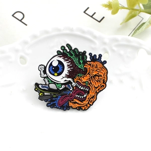 Quirky Halloween enamel pin featuring a monster with long tongue and skateboard on ceramic plate
