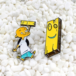 Cartoon enamel pin set featuring boy and wooden friend characters over white gravel
