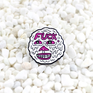Cartoon melting face round enamel pin with vibrant pink lettering on white pebble base