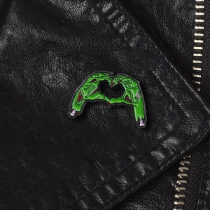 Gothic green zombie skeletal hands heart gesture enamel brooch on black leather jacket