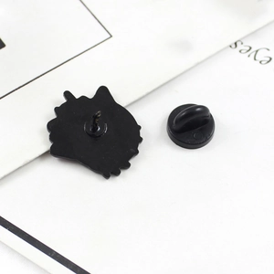 Detail view of the black enamel brooch back with secure rubber butterfly clutch pin