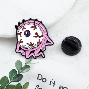 Creative pink eyeball enamel brooch with bloodshot detail and black rubber clutch back