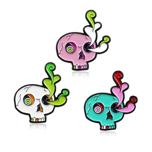 Trois broches tête de mort en émail rose blanc et cyan avec détails style pop art