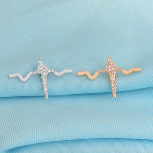 Detailed view of silver and rose gold heartbeat pins with sparkling micro-pave crystals