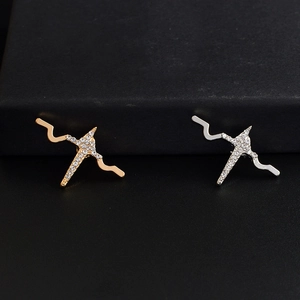 Sparkling cross-shaped brooch with clear crystals in gold and silver plating