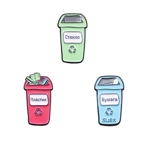 Three colorful enamel pins in red green and blue waste bin shapes for environmental recycling