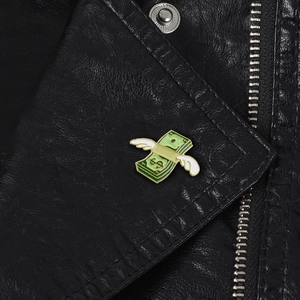 Creative flying dollar enamel brooch with white wings on black leather jacket lapel