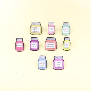 Set of 9 colorful enamel jar pins with motivational quotes for fashion accessories