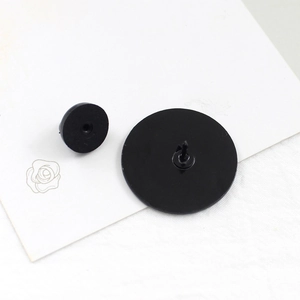 Creative floral Do No Harm enamel badge showing durable black rubber clutch and metal back pin