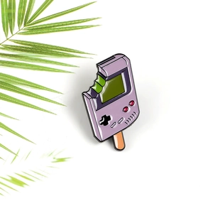 Creative purple handheld game console popsicle enamel pin badge with a bitten design