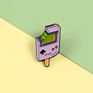 Macro detail of lavender game console popsicle enamel pin with green matcha core filling