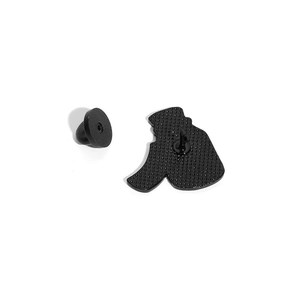 Black enamel pin back view featuring textured metal finish and secure rubber clutch