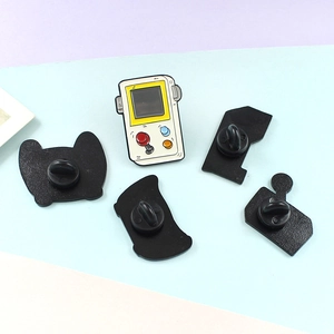 Creative enamel brooch featuring a retro handheld game console design with vibrant buttons