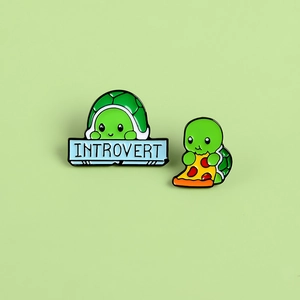 Cute cartoon green turtle enamel pin set featuring introvert slogan and pizza eating design