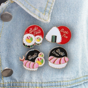 Cute set of 4 sushi enamel pins with funny slogans on a blue denim jacket pocket