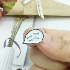 Enamel pin badge featuring Your Dog Has Fleas text in a white speech bubble design