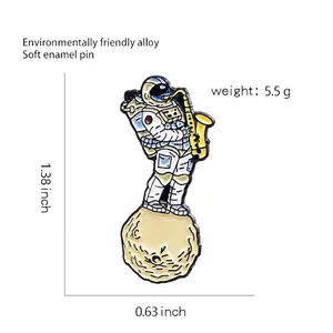 Cartoon astronaut playing saxophone enamel brooch pin on a planet base with dimensions