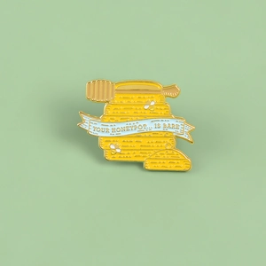 Cartoon bee and honey pot enamel pin with Your Honeypot is Bare ribbon design