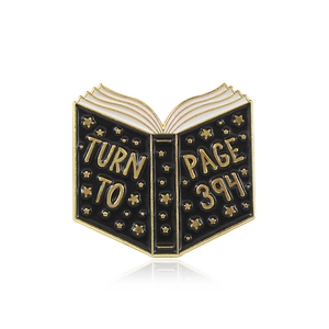 Creative black book enamel brooch featuring gold Page 394 lettering and stars for clothing